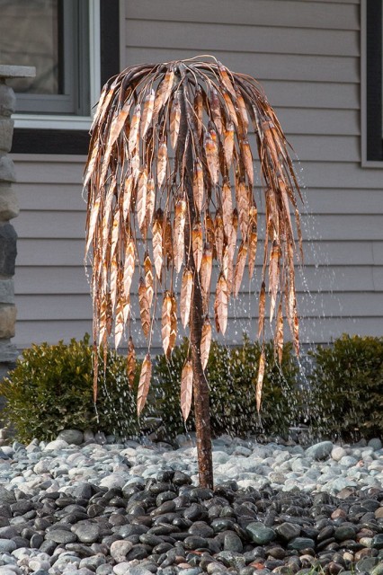 Aqua Bella Copper Tree Fountains Aqua Bella Copper Tree Fountains​ bring together art, metal, & water exactly where they belong...at your home. Create a striking visual both during the day &
